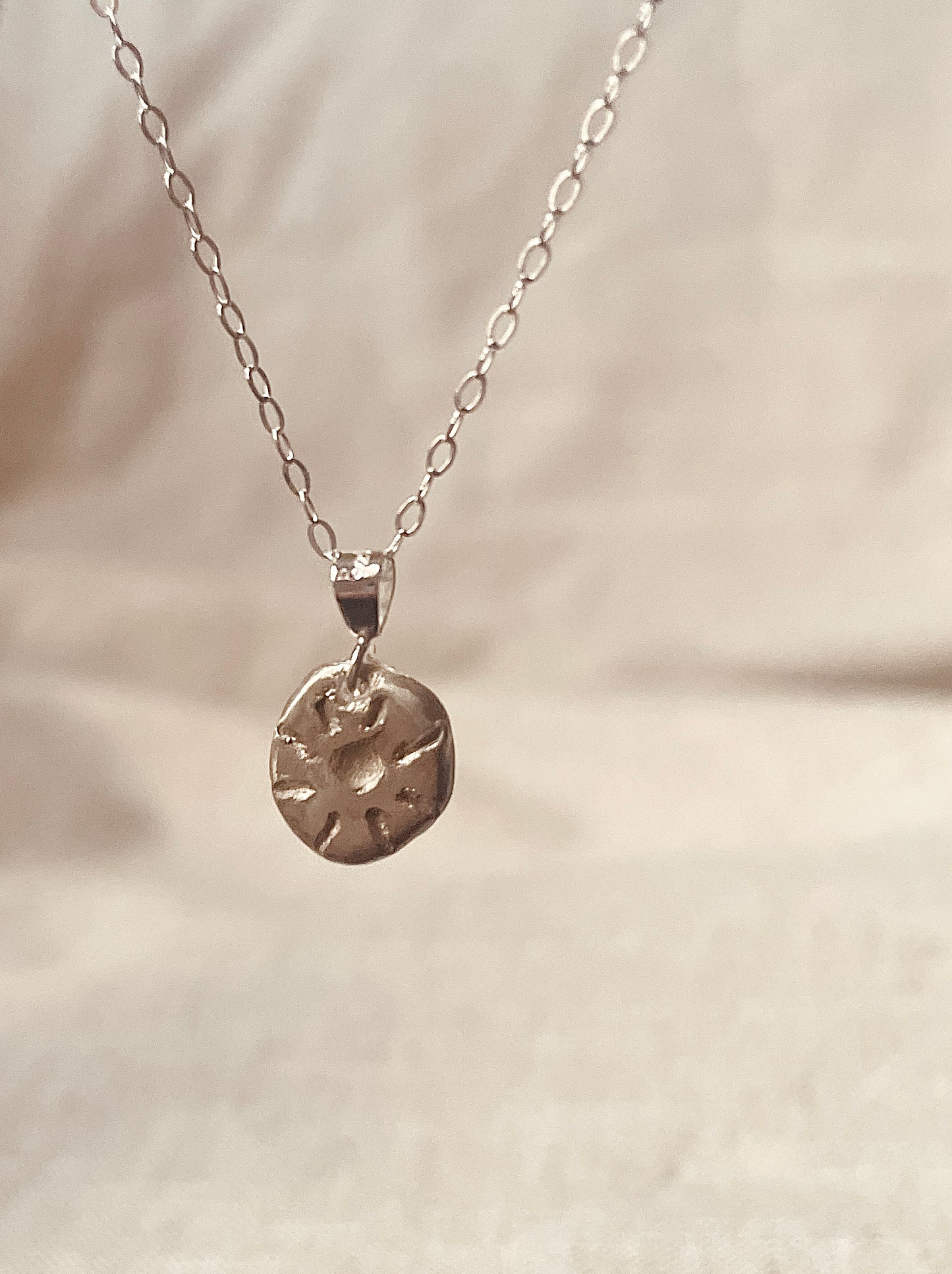 Carved Sun Pebble Necklace