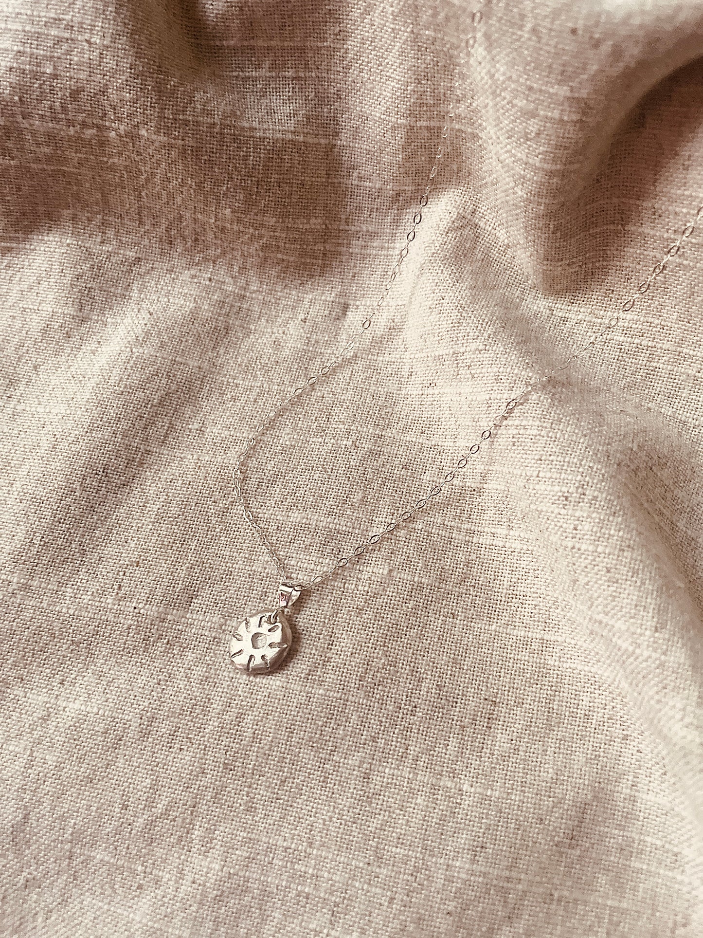 Carved Sun Pebble Necklace